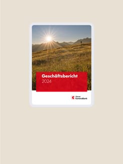 Mockup-Darstellung Geschäftsbericht der Glarner Kantonalbank auf sandigem Hintergrund