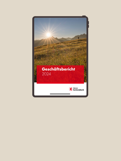 Mockup-Darstellung Geschäftsbericht der Glarner Kantonalbank auf sandigem Hintergrund